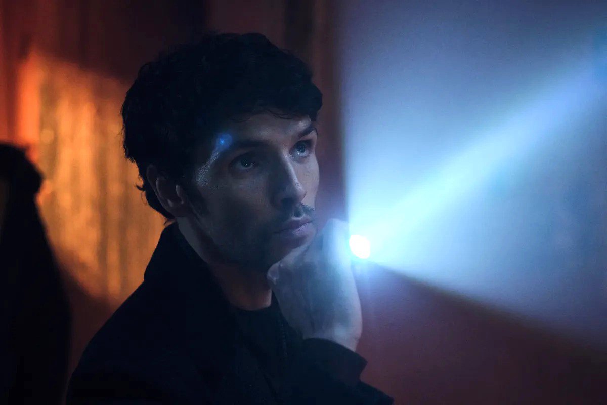 Colin Morgan holding a torch in a scene from The Killing Kind.